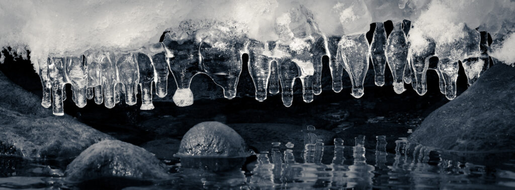 ice-formations-over-river-black-and-white-nature-detail