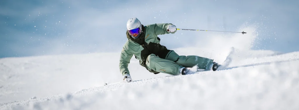 Ski photography example of skier mid-action in snowy terrain, showing the importance of reliable autofocus tracking
