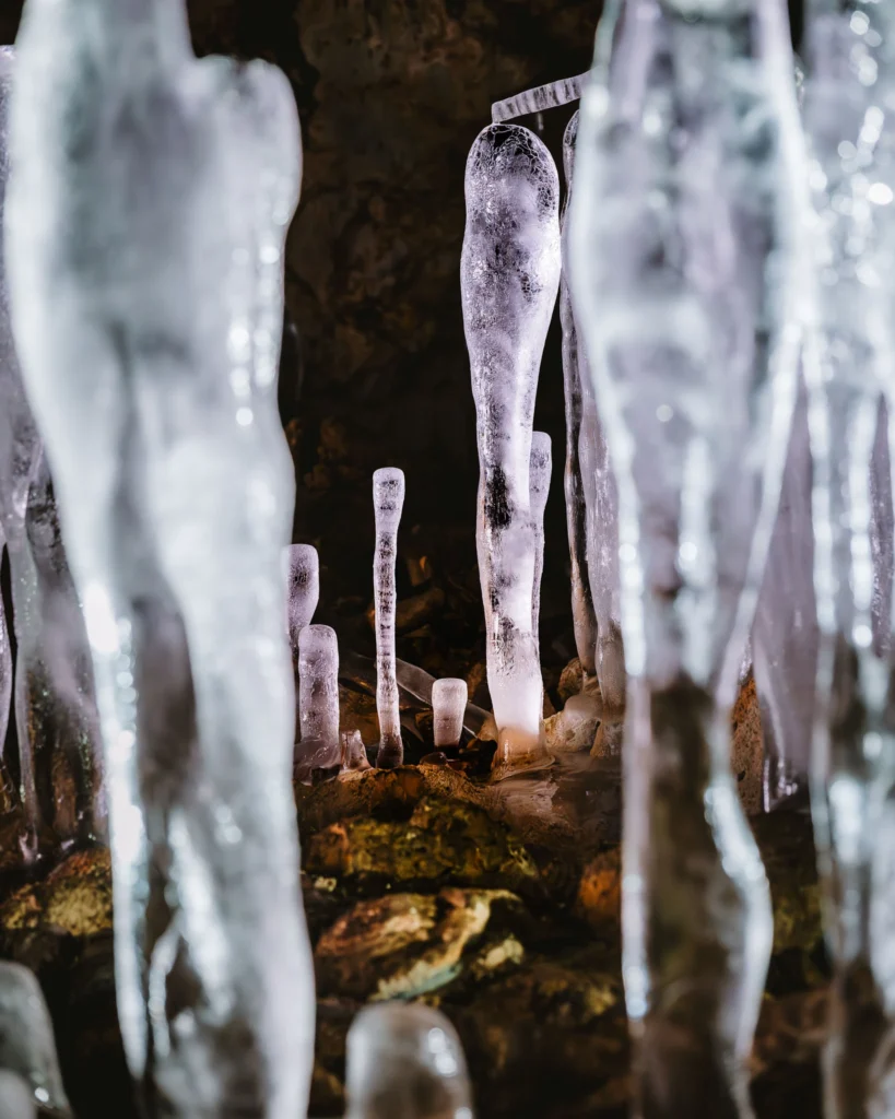 Ice formations in a dark cave photographed handheld with the Nikon Z8 at ISO 3200