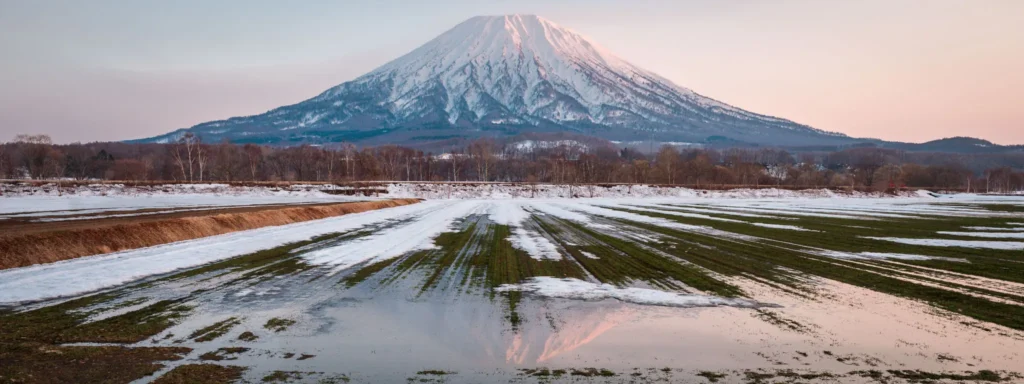 Mount Yotei landscape in Hokkaido with spring snow melt and reflection
