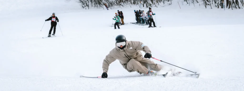 Skier carving on piste with busy background showing Nikon Z8 autofocus performance