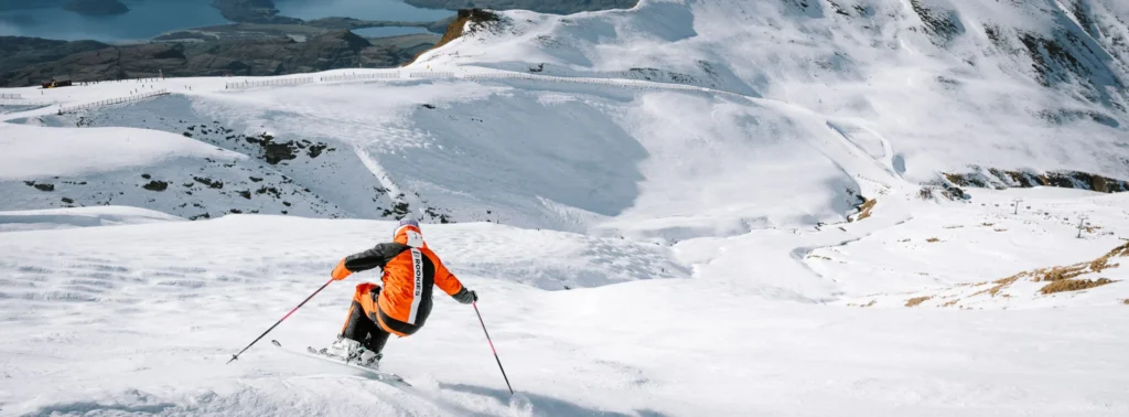 Skier descending a wide alpine slope captured with Nikon Z8 ski photography settings