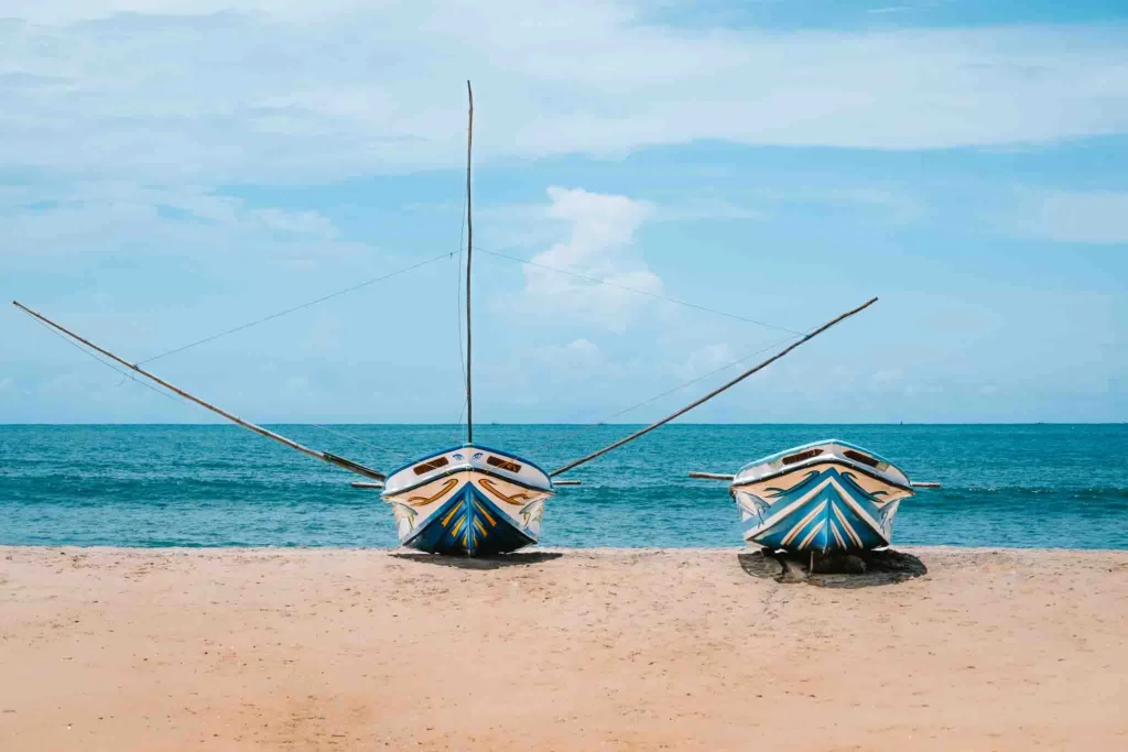 Fishing boats on Arugam Bay beach, a reminder that the town is more than just a surf destination.